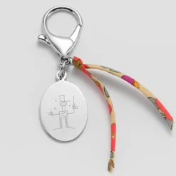 Bijou de sac personnalisé médaille gravée acier ovale 33x25 mm et noeud Liberty