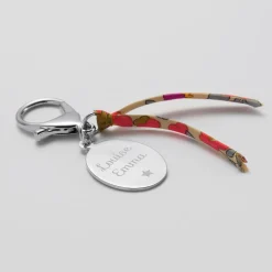 Bijou de sac personnalisé médaille gravée acier ovale 33x25 mm et noeud Liberty