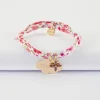 Bracelet enfant Liberty personnalisé médaille gravée plaqué or nuage 20x14 mm et breloque fleur pétales zircons 10 mm