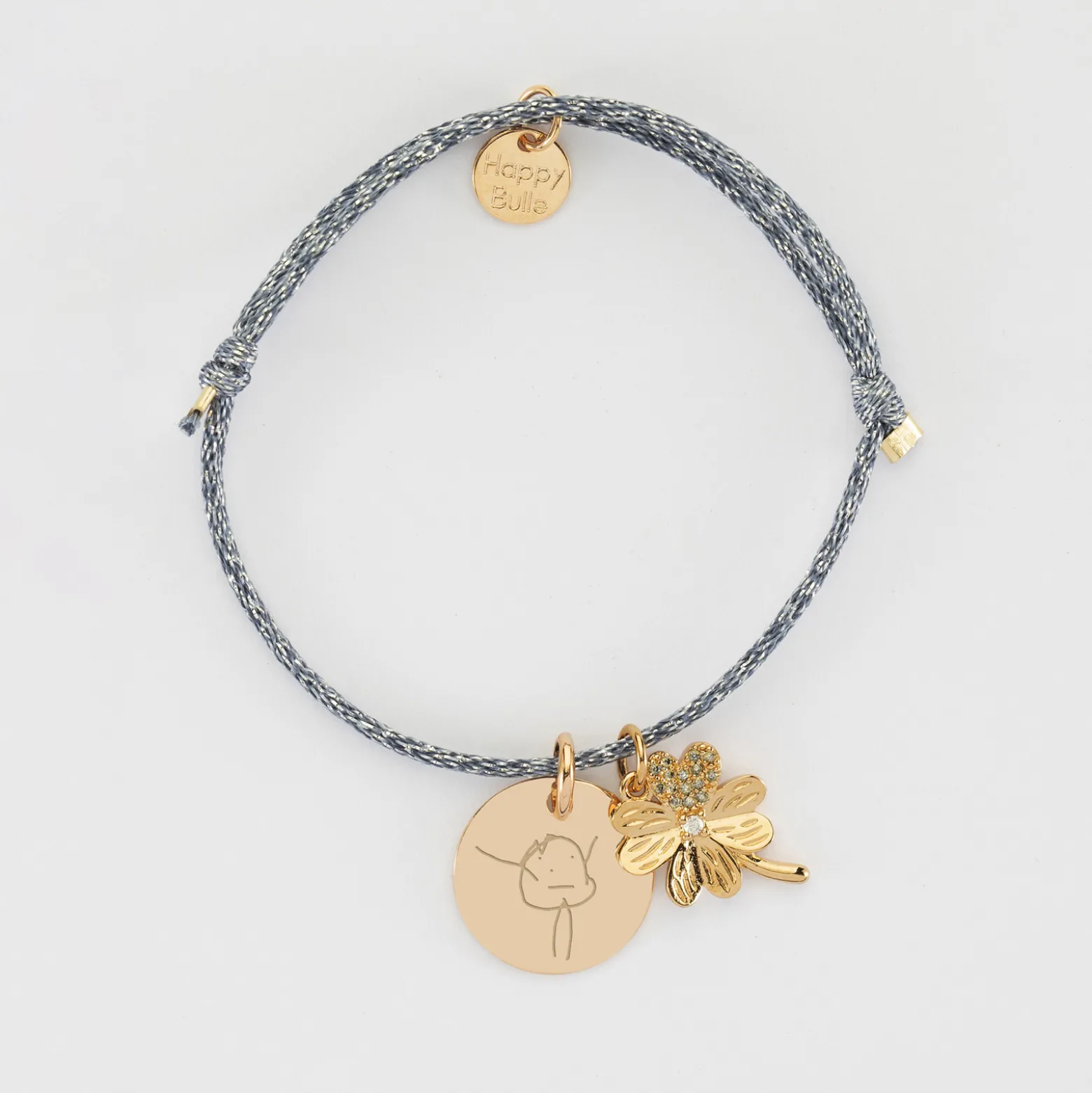 Bracelet enfant personnalisé cordon pailleté médaille gravée plaqué or 15 mm et breloque trèfle scintillant 15 mm