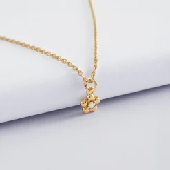 Pendentif enfant fleur zircon plaqué or 8 mm