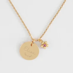 Pendentif enfant personnalisé médaille gravée plaqué or 15 mm et breloque fleur zircon plaqué or 8 mm