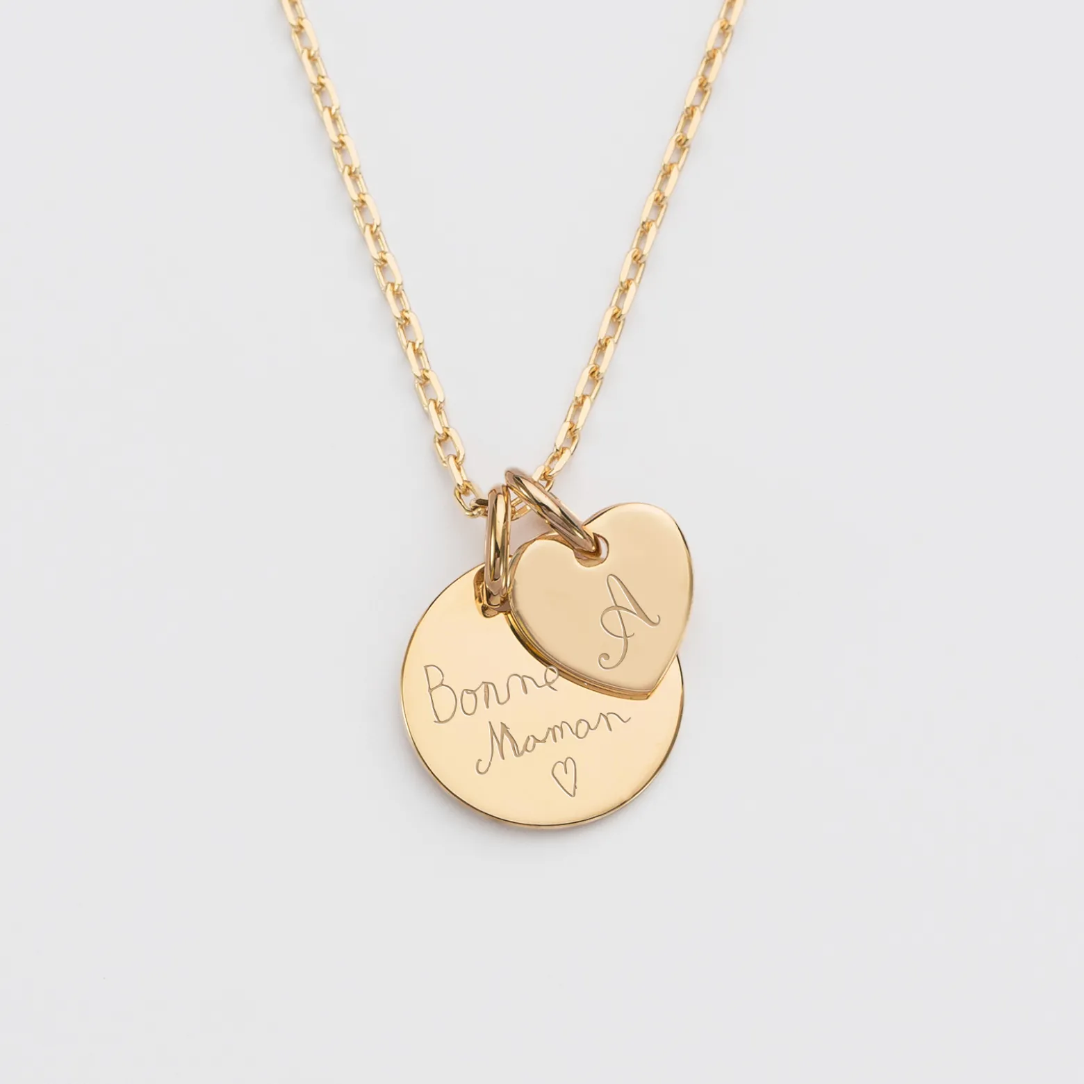 Pendentif personnalisé médaille gravée plaqué or 15 mm et breloque coeur 10 mm