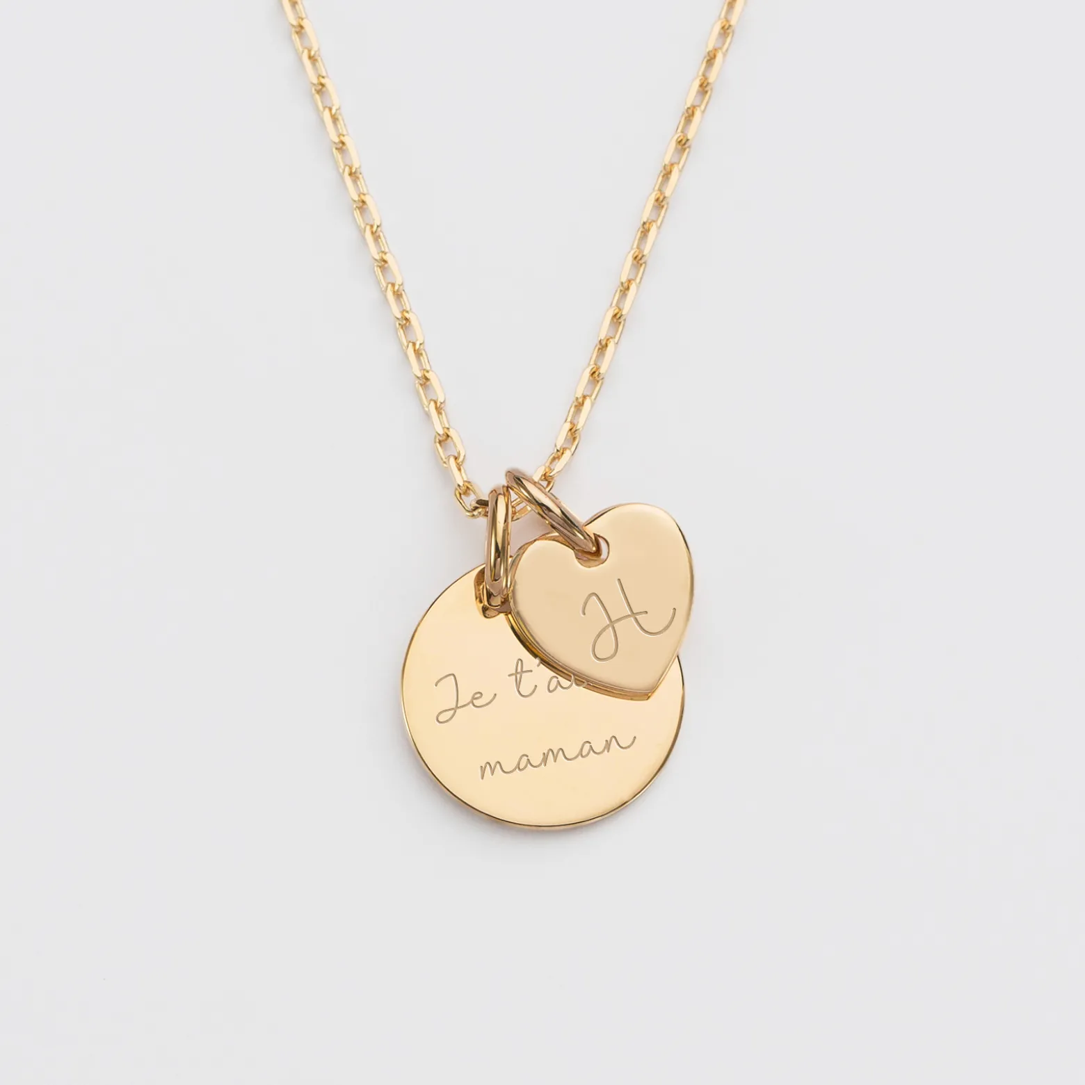 Pendentif personnalisé médaille gravée plaqué or 15 mm et breloque coeur 10 mm