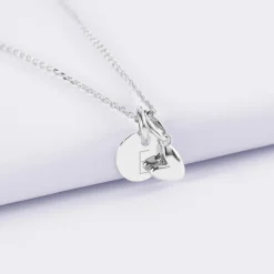 Pendentif personnalisé médaille gravée argent 10 mm et breloque petit coeur bombé 7 mm - HappyBulle x Atelier Wagram