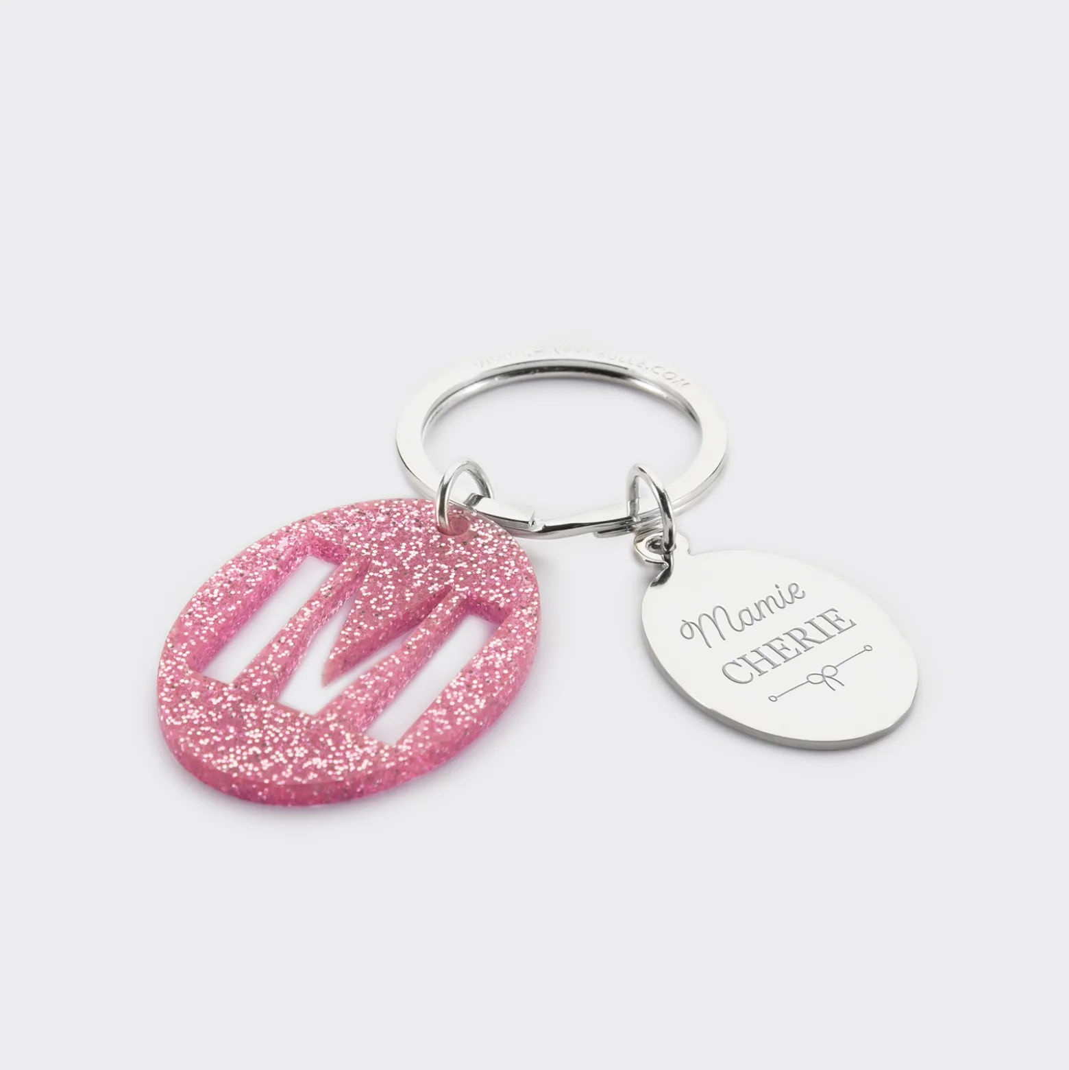Porte-clés personnalisé médaille gravée ovale acier et breloque initiale acrylique pailleté rose